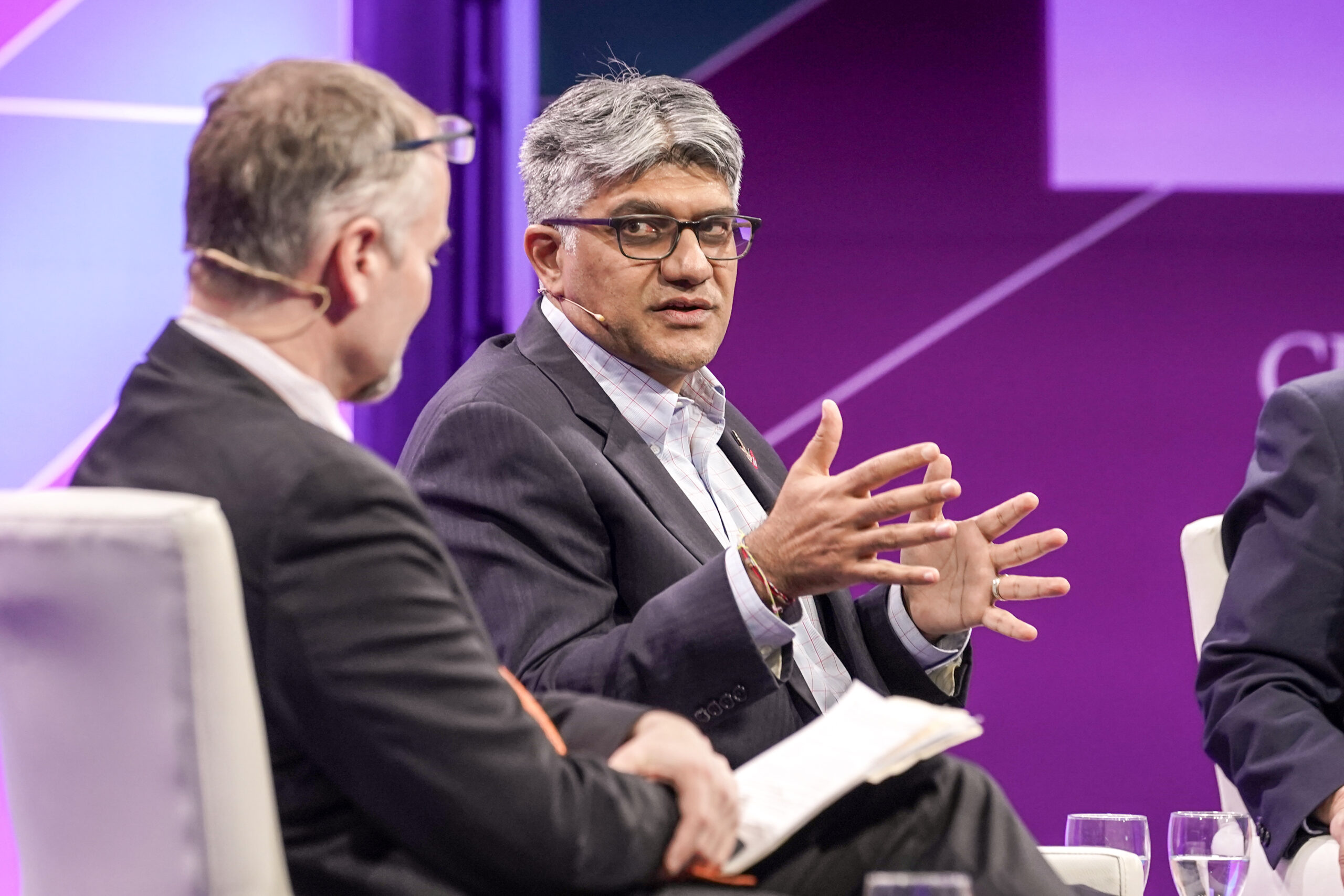 Jigar Shah, director of the Loan Programs Office, speaking at CERA Week in March. Against a purple background