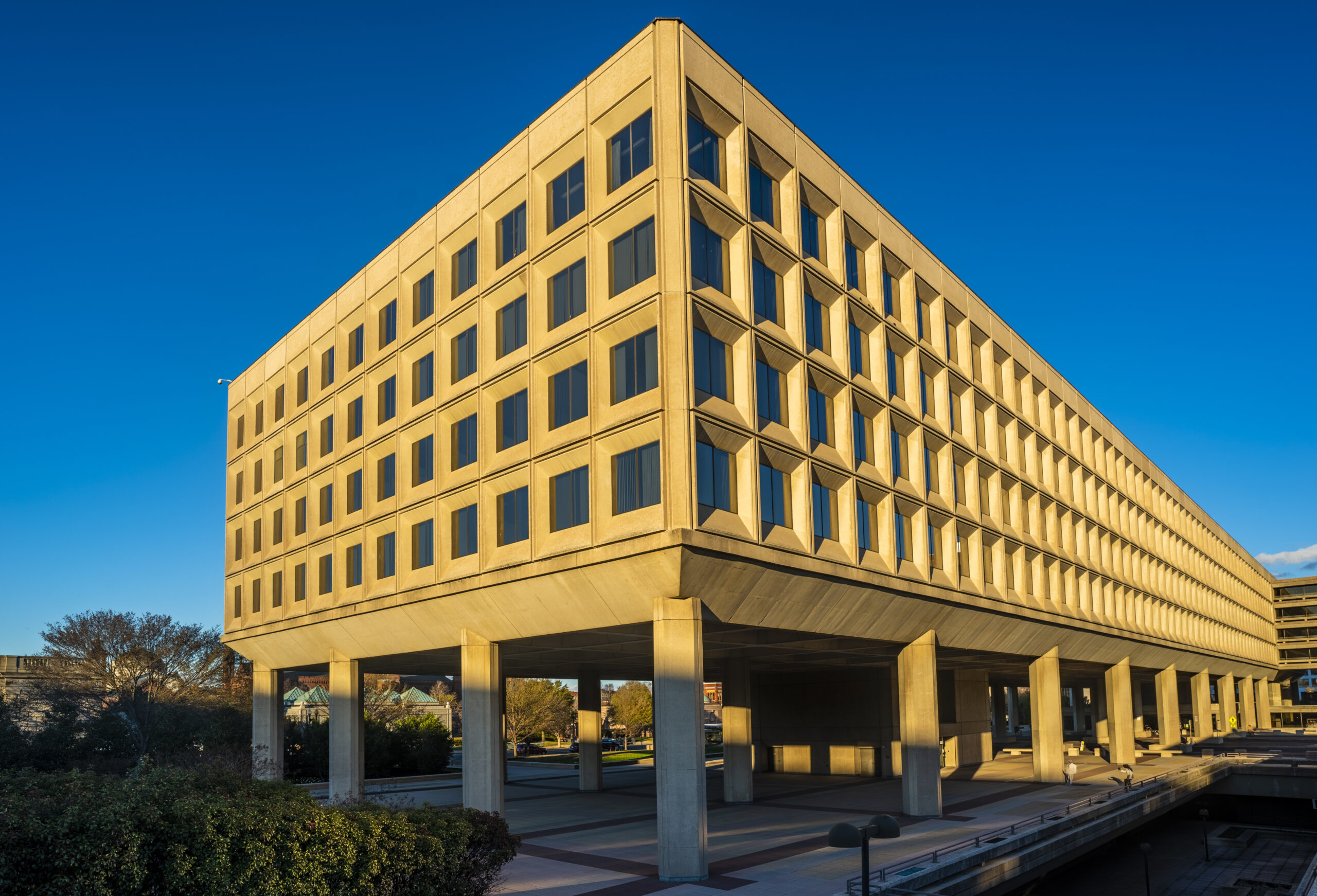 Photo of the the Department of Energy Building in downtown Washington DC, USA, against a blue backdrop.