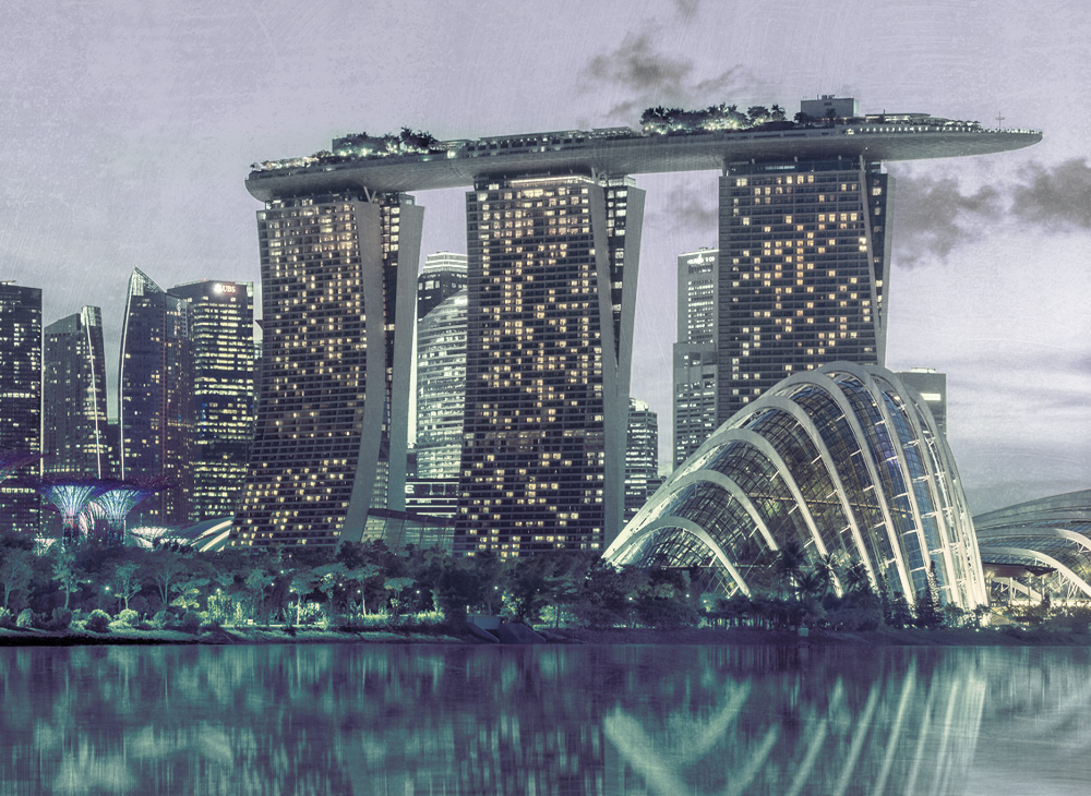 Singapore's skyline at sunset, dotted by spectacular tall buildings.