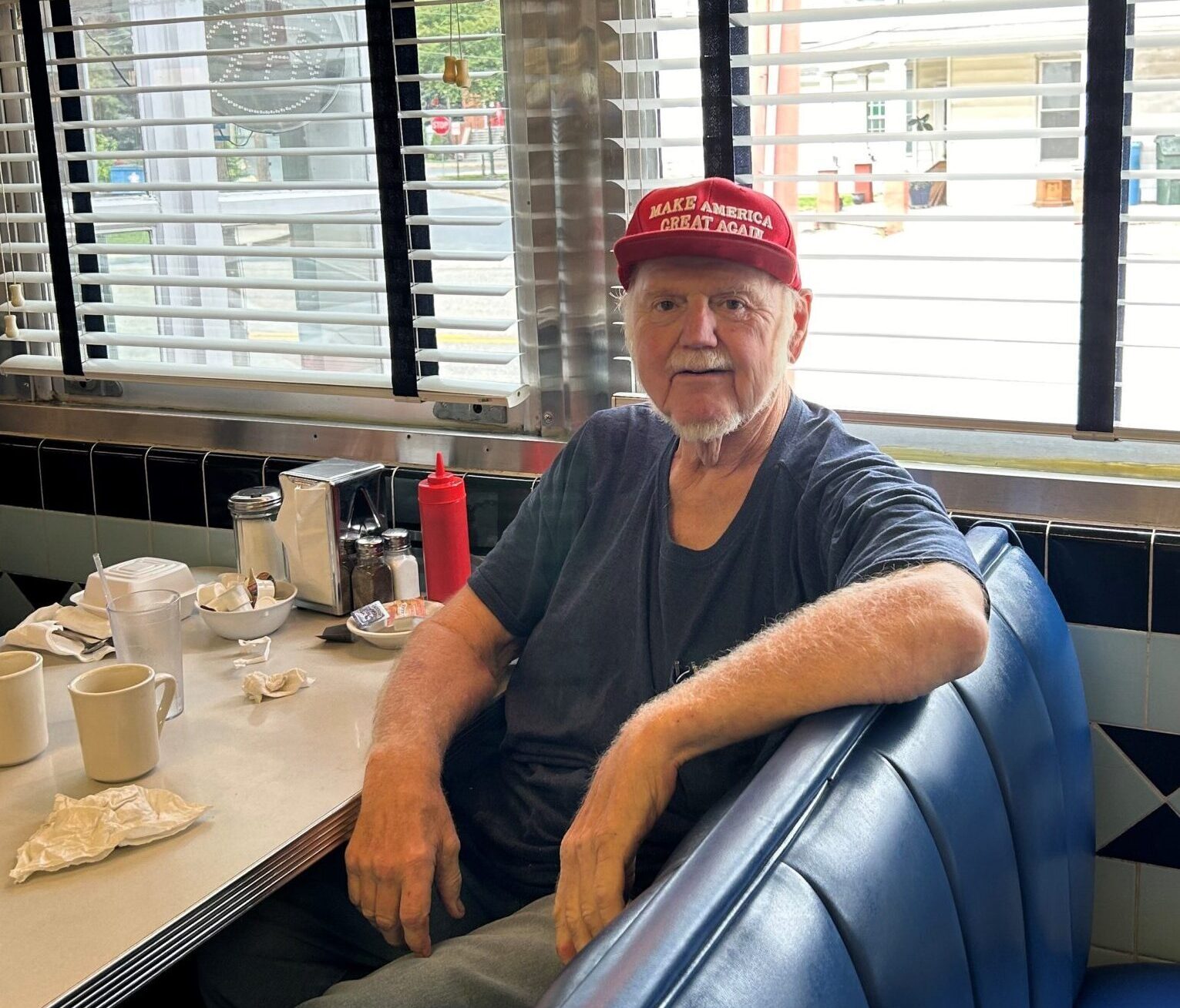 Retired engineer Dale Burk proudly shows off his MAGA hat inside the Higspire Diner in Pennslyvania. Photo by Amena H. Saiyid