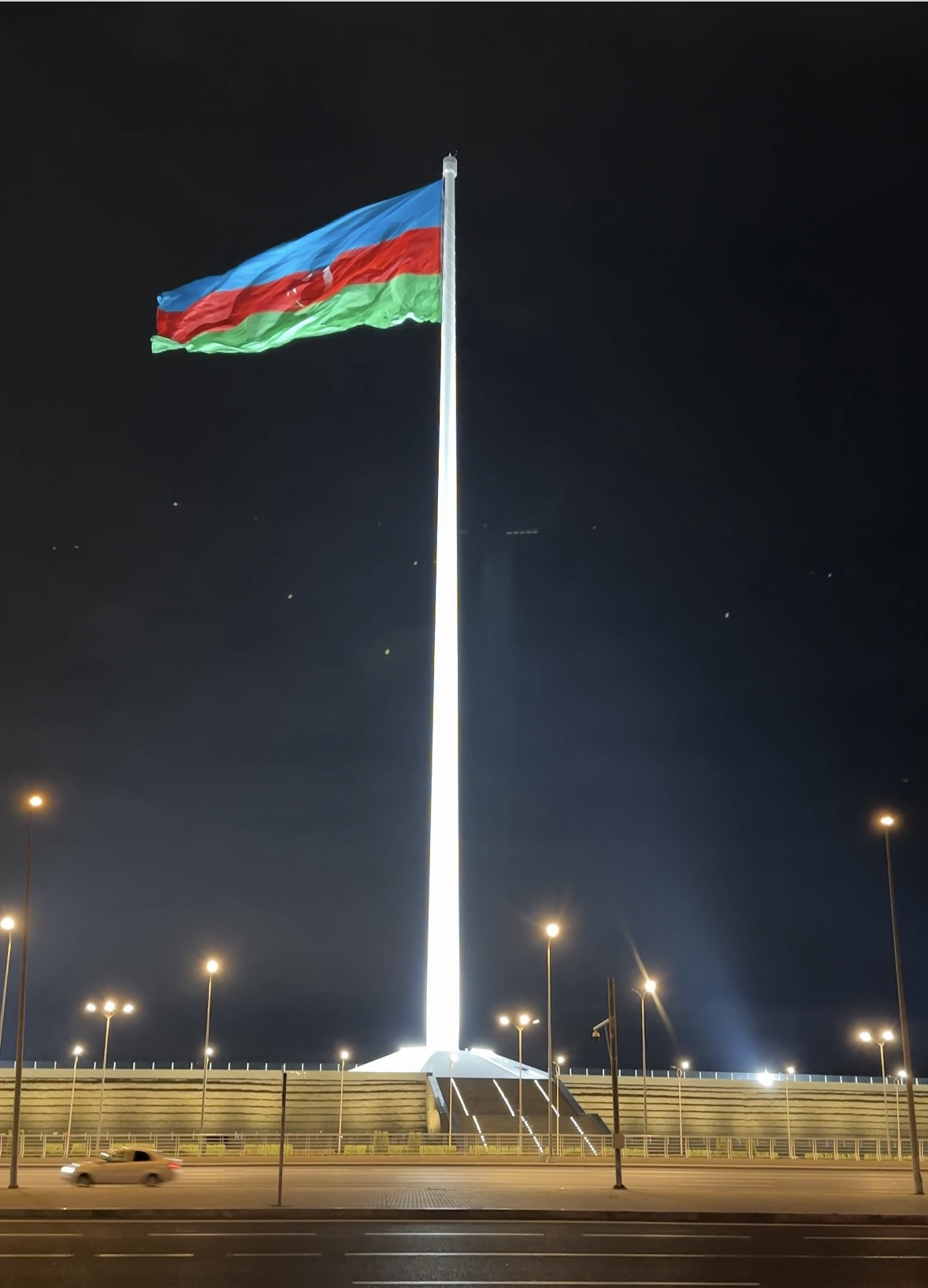 A giant Azerbaijani flag flying over State Flag Square in Baku, Azerbaijan. Photo by Anca Gurzu, November 2024.