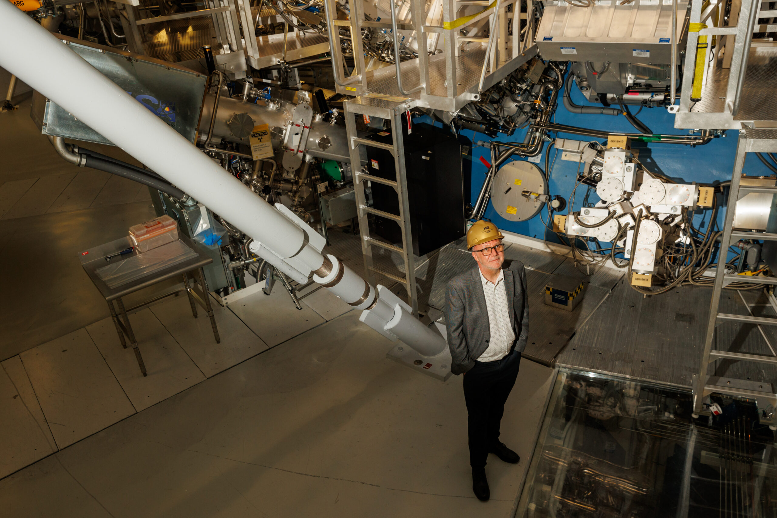 Richard Town, who leads the inertial confinement fusion program at Lawrence Livermore National Laboratory, standing inside the National Ignition Facility at Livermore.